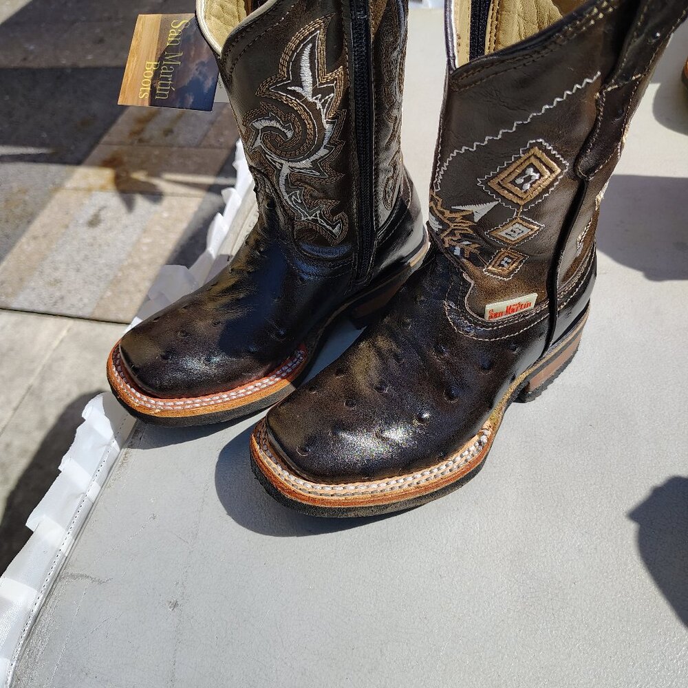( Girls ) Leather cowboy boots.